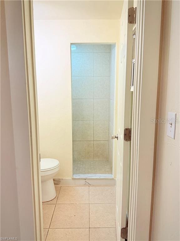 3902 Locust Ave, Sarasota, FL 34234 - bathroom with tile patterned floors and tiled shower
