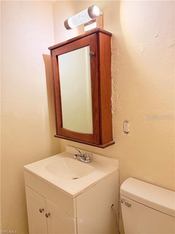 3902 Locust Ave, Sarasota, FL 34234 - bathroom with vanity and toilet