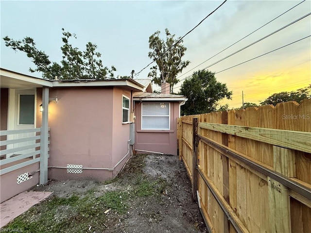 3902 Locust Ave, Sarasota, FL 34234 - view of side of property featuring a fenced backyard and stucco siding