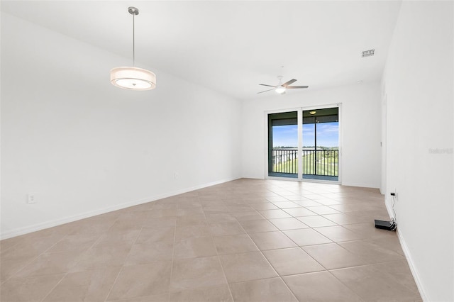 17565 Opal Sand Dr Unit 403, Venice, FL 34293 - empty room with a ceiling fan and light tile patterned flooring