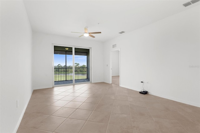 17565 Opal Sand Dr Unit 403, Venice, FL 34293 - spare room with a ceiling fan and light tile patterned flooring