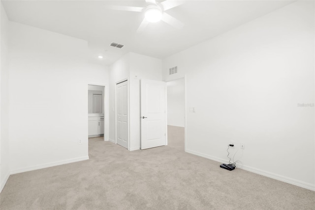 17565 Opal Sand Dr Unit 403, Venice, FL 34293 - unfurnished bedroom featuring light carpet, a closet, ceiling fan, and recessed lighting
