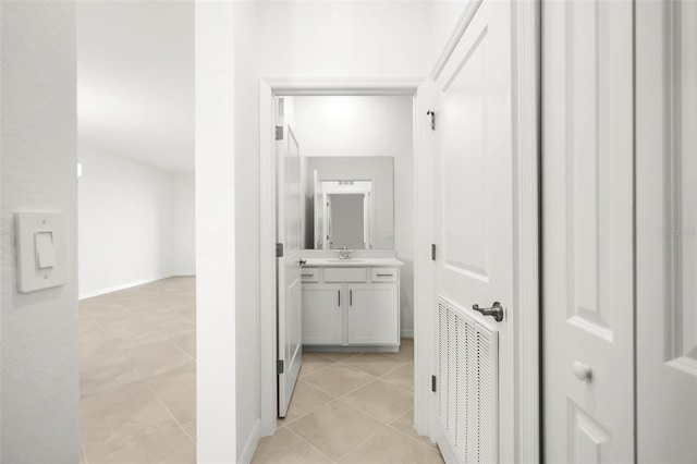 17565 Opal Sand Dr Unit 403, Venice, FL 34293 - corridor featuring light tile patterned floors and a sink