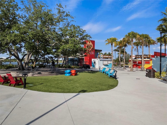 17565 Opal Sand Dr Unit 403, Venice, FL 34293 - view of playground with a lawn