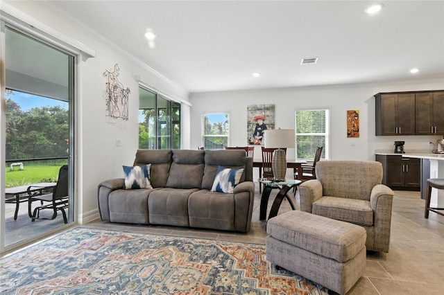2456 Nabble Ln, North Port, FL 34288 - living room with healthy amount of natural light, recessed lighting, crown molding, and light tile patterned floors