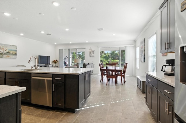 2456 Nabble Ln, North Port, FL 34288 - kitchen with dishwasher, crown molding, recessed lighting, light tile patterned flooring, and open floor plan