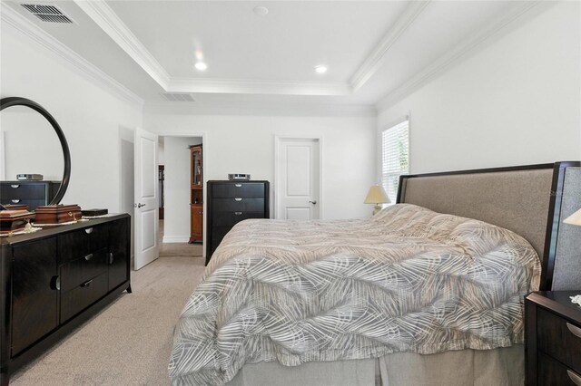 2456 Nabble Ln, North Port, FL 34288 - bedroom featuring light carpet, a tray ceiling, and ornamental molding