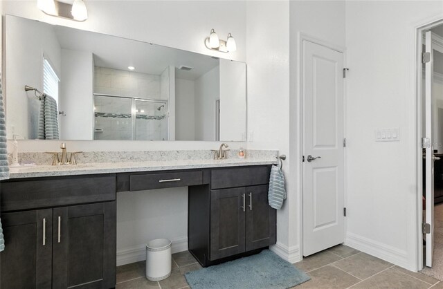 2456 Nabble Ln, North Port, FL 34288 - full bath with double vanity, a shower stall, and tile patterned flooring