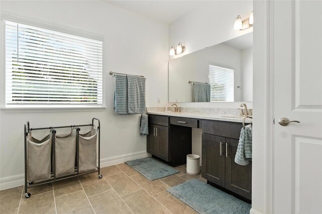 2456 Nabble Ln, North Port, FL 34288 - full bath featuring double vanity and tile patterned flooring