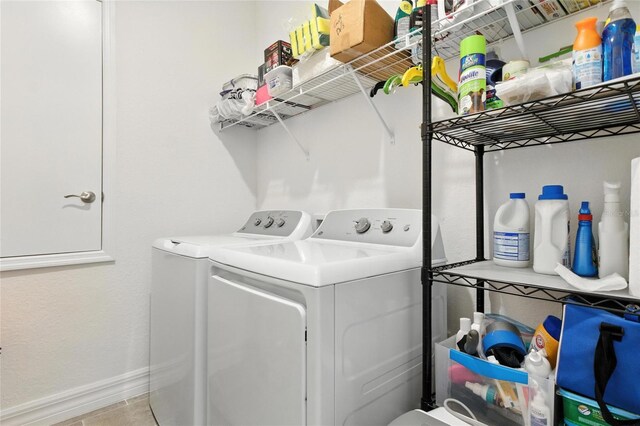 2456 Nabble Ln, North Port, FL 34288 - laundry room featuring washer and dryer and baseboards