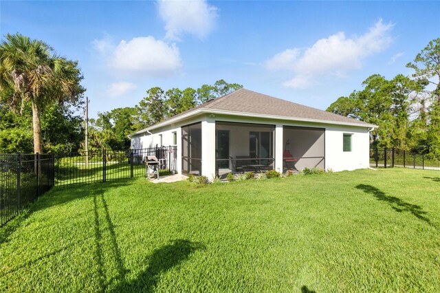2456 Nabble Ln, North Port, FL 34288 - rear view of house with a sunroom and a fenced backyard