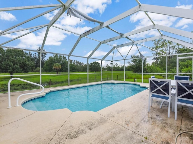 9761 Councilor Ln, North Fort Myers, FL 33917 - swimming pool with a patio, a lawn, and view of scattered trees