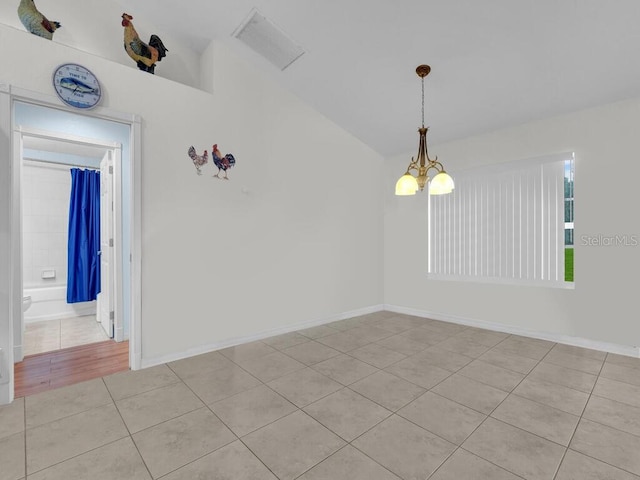 9761 Councilor Ln, North Fort Myers, FL 33917 - empty room with light tile patterned flooring, a chandelier, and lofted ceiling
