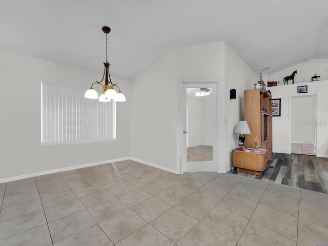 9761 Councilor Ln, North Fort Myers, FL 33917 - tiled empty room featuring vaulted ceiling and a chandelier