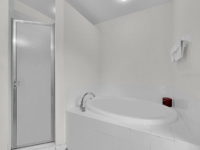 9761 Councilor Ln, North Fort Myers, FL 33917 - bathroom with a shower stall and a garden tub