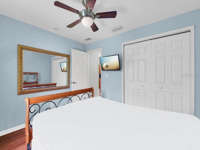 9761 Councilor Ln, North Fort Myers, FL 33917 - bedroom with wood finished floors, a closet, and ceiling fan