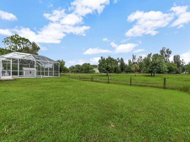 9761 Councilor Ln, North Fort Myers, FL 33917 - view of yard featuring a lanai, a swimming pool, and a view of countryside