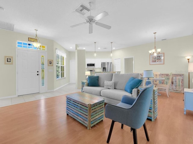 2040 Embarcadero Way N, Fort Myers, FL 33917 - living room with light wood-style flooring, a chandelier, ceiling fan, and recessed lighting