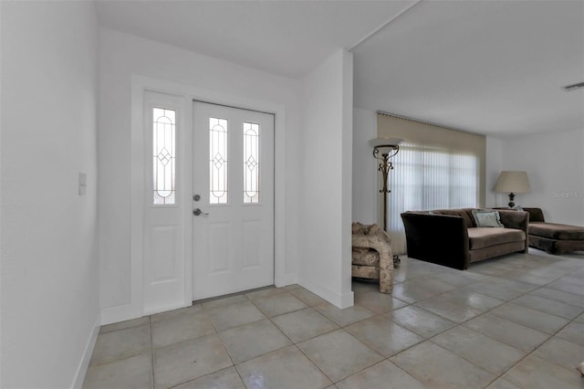 16 Tropicana Dr, Punta Gorda, FL 33950 - foyer featuring healthy amount of natural light and light tile patterned floors