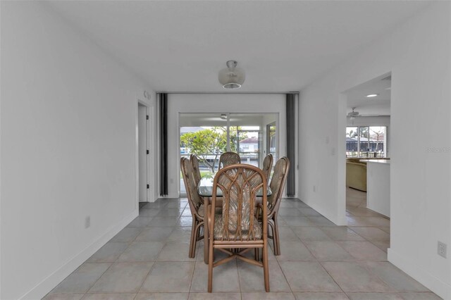 16 Tropicana Dr, Punta Gorda, FL 33950 - dining space with healthy amount of natural light, light tile patterned flooring, and a ceiling fan