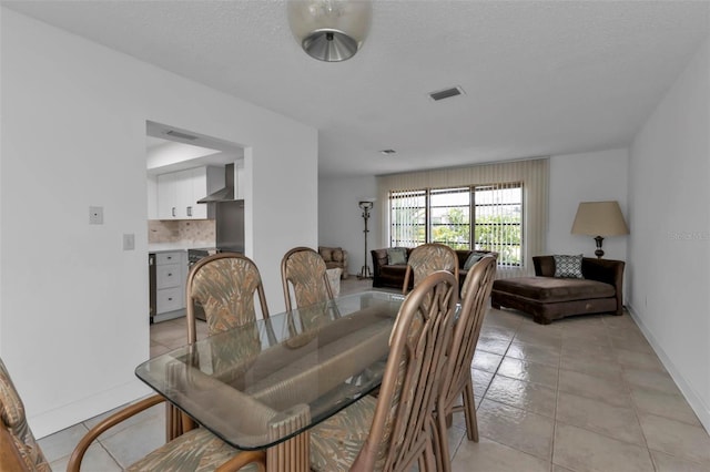 16 Tropicana Dr, Punta Gorda, FL 33950 - dining space featuring baseboards and light tile patterned floors