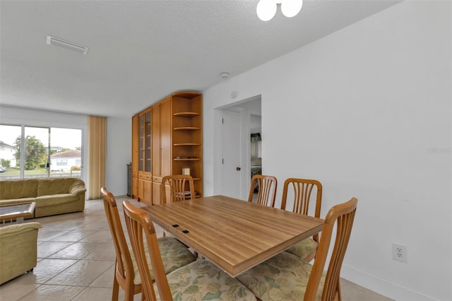 16 Tropicana Dr, Punta Gorda, FL 33950 - dining space featuring light tile patterned floors