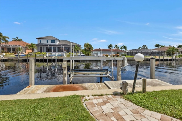16 Tropicana Dr, Punta Gorda, FL 33950 - dock area with a water view, boat lift, and a residential view