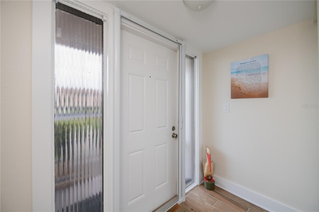 1080 Bal Harbor Blvd Unit 5B, Punta Gorda, FL 33950 - foyer entrance with baseboards and light wood-type flooring