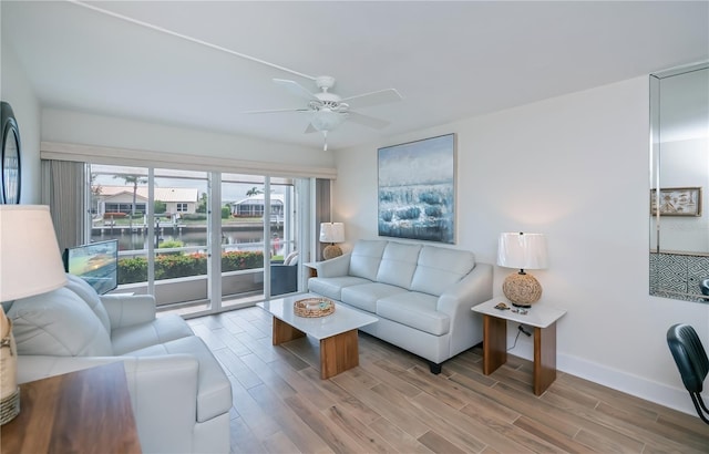 1080 Bal Harbor Blvd Unit 5B, Punta Gorda, FL 33950 - living room with wood finished floors and ceiling fan