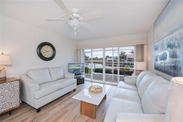 1080 Bal Harbor Blvd Unit 5B, Punta Gorda, FL 33950 - living room with wood finished floors and ceiling fan