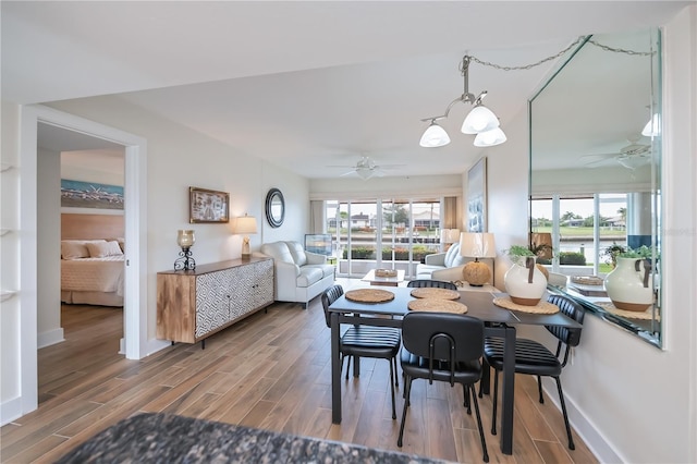 1080 Bal Harbor Blvd Unit 5B, Punta Gorda, FL 33950 - dining area featuring ceiling fan, healthy amount of natural light, and wood finished floors