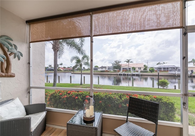 1080 Bal Harbor Blvd Unit 5B, Punta Gorda, FL 33950 - sunroom / solarium with a water view, healthy amount of natural light, and a residential view
