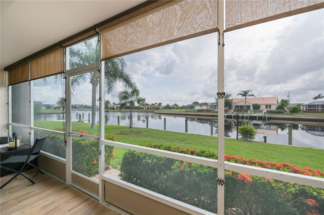 1080 Bal Harbor Blvd Unit 5B, Punta Gorda, FL 33950 - sunroom / solarium featuring a water view and a residential view
