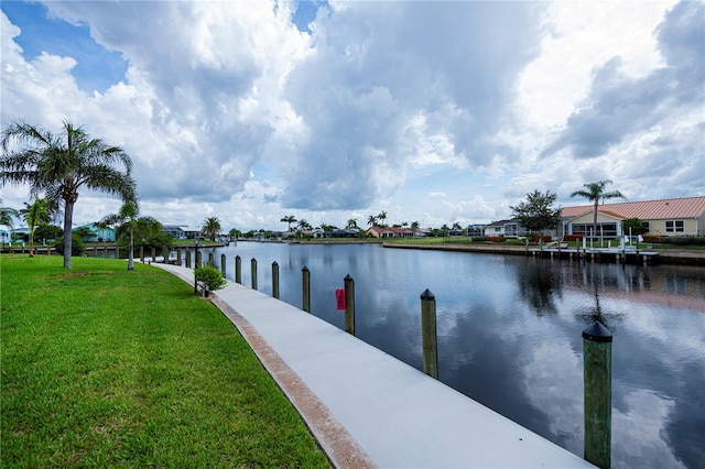 1080 Bal Harbor Blvd Unit 5B, Punta Gorda, FL 33950 - dock area with a water view, a lawn, and a residential view