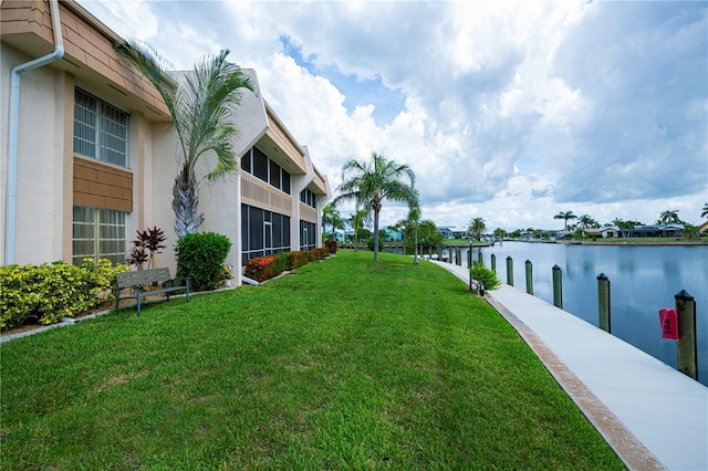 1080 Bal Harbor Blvd Unit 5B, Punta Gorda, FL 33950 - view of grassy yard featuring a water view and a dock