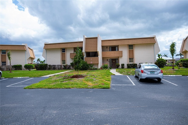 1080 Bal Harbor Blvd Unit 5B, Punta Gorda, FL 33950 - view of building exterior with uncovered parking