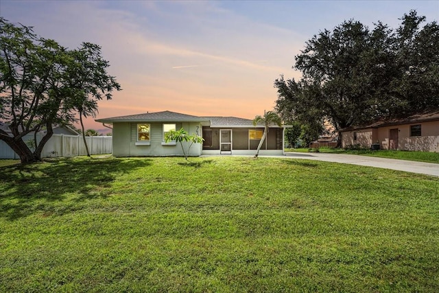 740 Dobell Ter NW, Port Charlotte, FL 33948 - ranch-style house featuring driveway and a sunroom