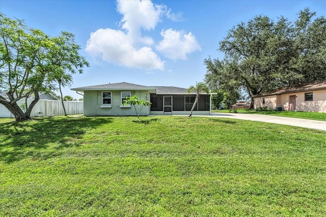 740 Dobell Ter NW, Port Charlotte, FL 33948 - rear view of house featuring a sunroom and driveway