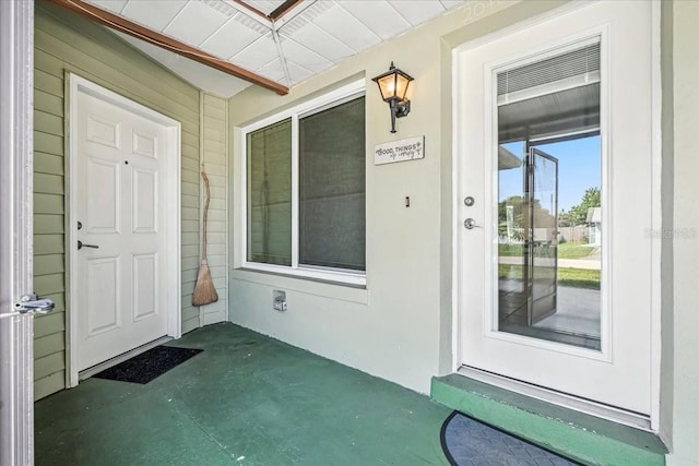 740 Dobell Ter NW, Port Charlotte, FL 33948 - doorway to property featuring a porch