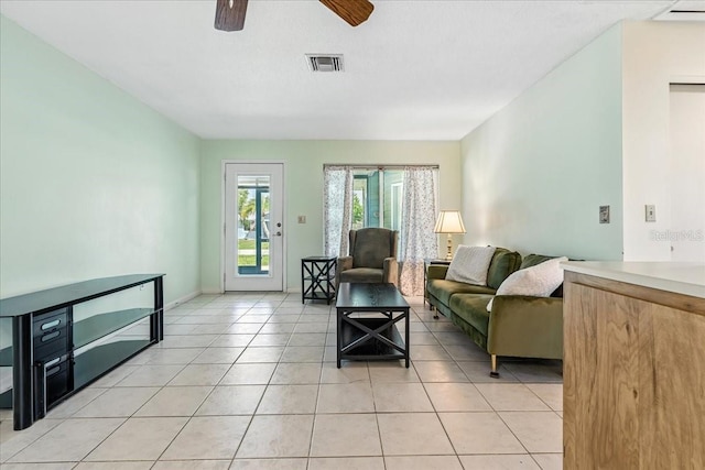 740 Dobell Ter NW, Port Charlotte, FL 33948 - living room with a ceiling fan and light tile patterned floors