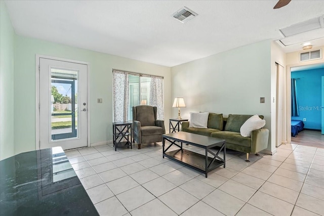 740 Dobell Ter NW, Port Charlotte, FL 33948 - living area with light tile patterned floors and healthy amount of natural light
