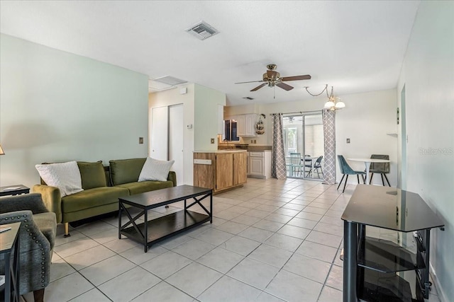 740 Dobell Ter NW, Port Charlotte, FL 33948 - living room with a ceiling fan and light tile patterned floors