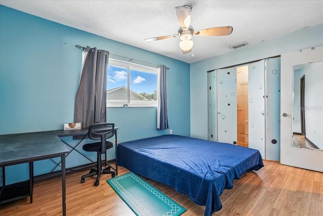740 Dobell Ter NW, Port Charlotte, FL 33948 - bedroom with wood finished floors, a textured ceiling, ceiling fan, and pool table
