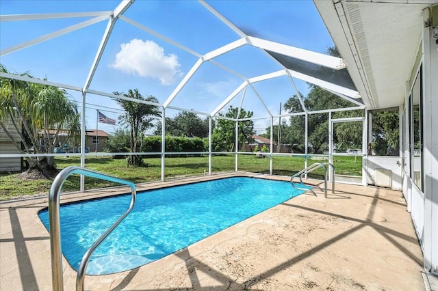 740 Dobell Ter NW, Port Charlotte, FL 33948 - outdoor pool featuring a patio area, a lawn, and glass enclosure