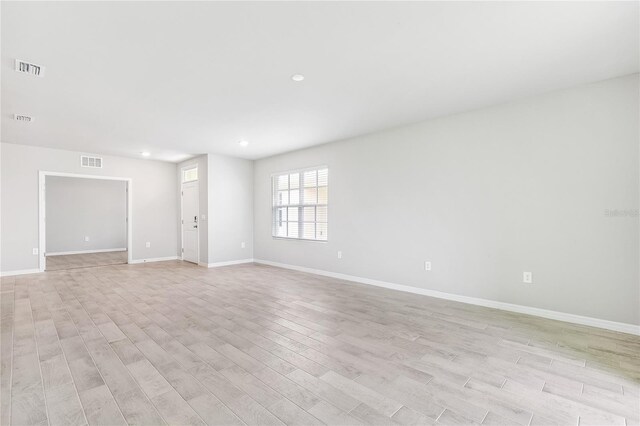 2047 Royal Tern Cir, Punta Gorda, FL 33983 - spare room featuring light wood-style flooring and recessed lighting