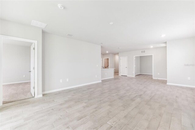 2047 Royal Tern Cir, Punta Gorda, FL 33983 - unfurnished living room featuring light wood-style floors and recessed lighting