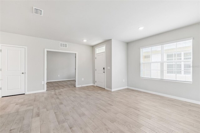 2047 Royal Tern Cir, Punta Gorda, FL 33983 - unfurnished room with light wood-style floors and recessed lighting
