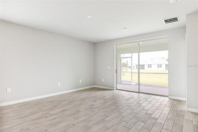 2047 Royal Tern Cir, Punta Gorda, FL 33983 - empty room with light wood finished floors and baseboards