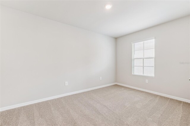 2047 Royal Tern Cir, Punta Gorda, FL 33983 - empty room featuring light carpet and recessed lighting