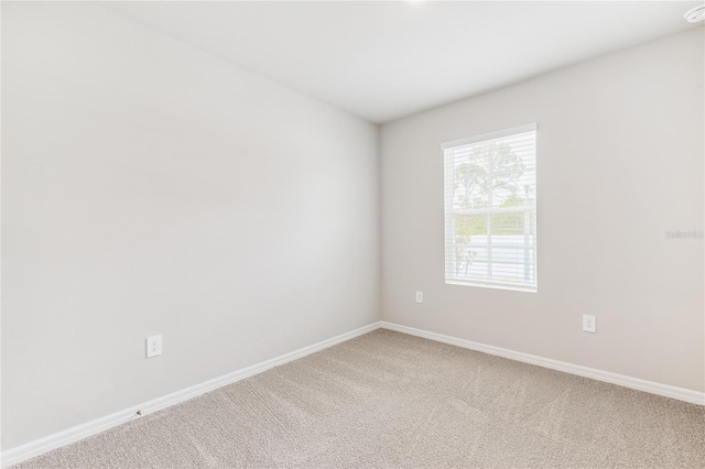2047 Royal Tern Cir, Punta Gorda, FL 33983 - carpeted spare room with baseboards and a smoke detector